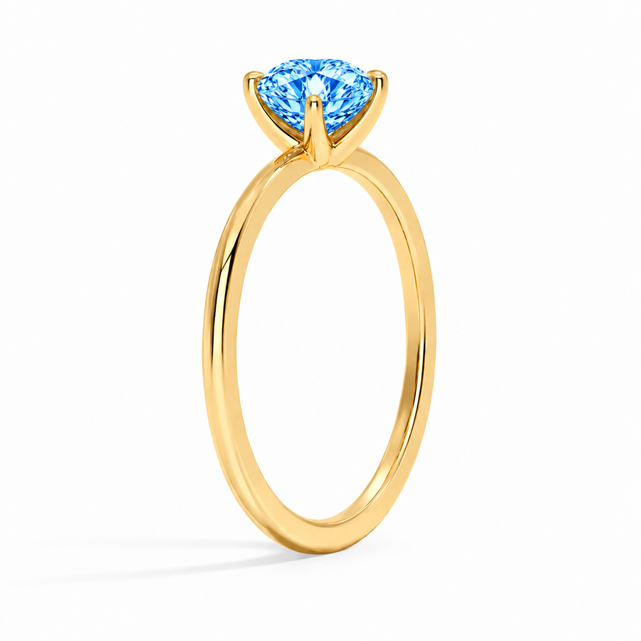 Seitenansicht: Herz Solitär-Verlobungsring aus Gelbgold mit blauem Labordiamant