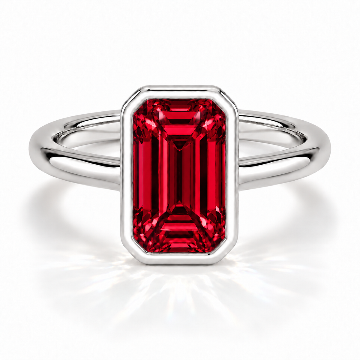 Gia Verlobungsring mit rotem Laborrubin im Emerald-Schliff und Bezel-Fassung in Weißgold – Frontalansicht auf weißem Hintergrund