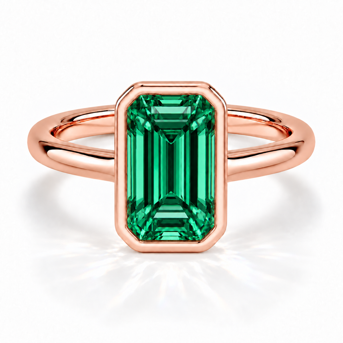 Gia Verlobungsring mit grünem Laborsmaragd im Emerald-Schliff und Bezel-Fassung in Roségold – Frontalansicht auf weißem Hintergrund