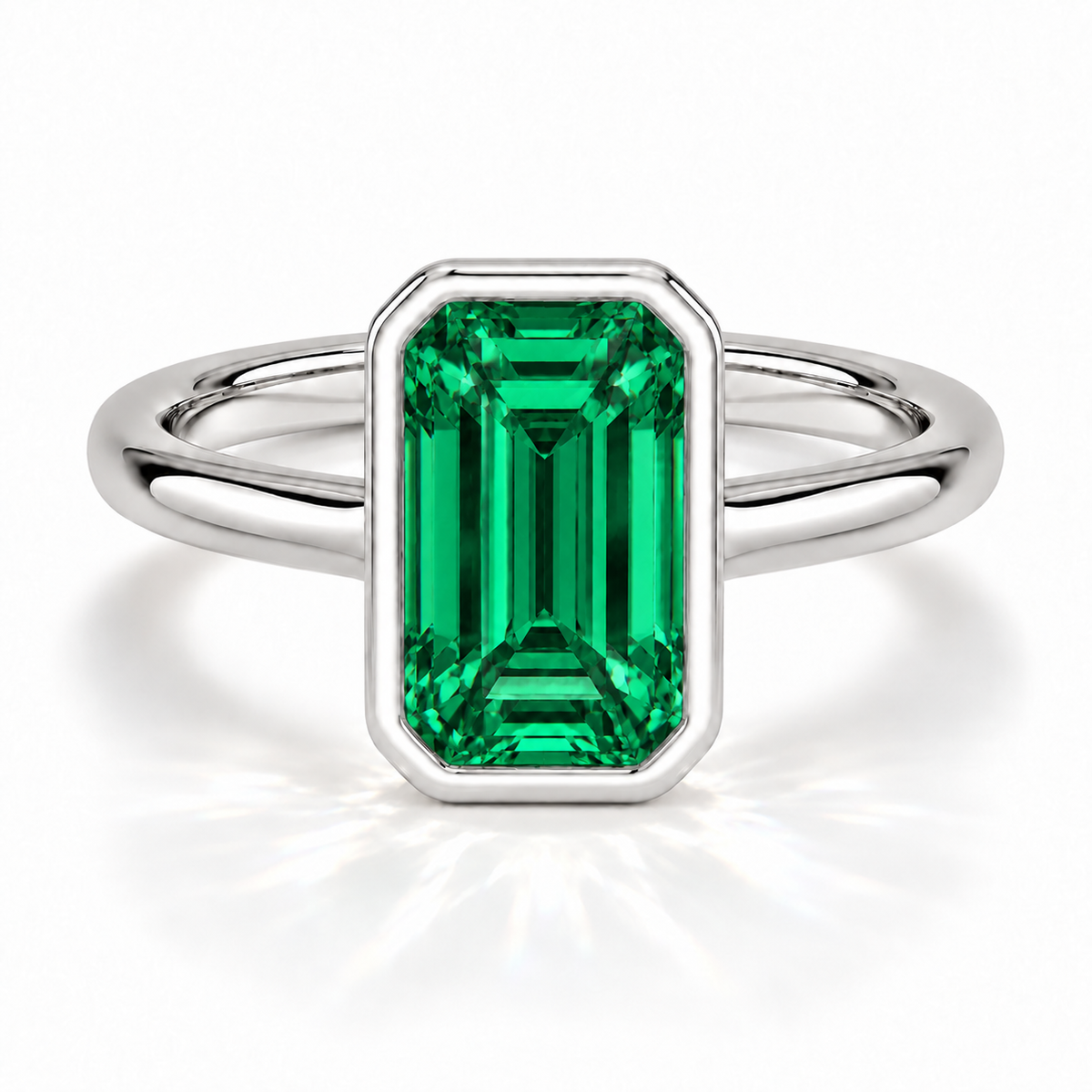 Gia Verlobungsring mit grünem Laborsmaragd im Emerald-Schliff und Bezel-Fassung in Weißgold – Frontalansicht auf weißem Hintergrund