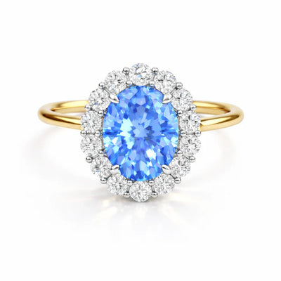Ovaler Halo-Ring aus Gelbgold mit blauem Mittelstein